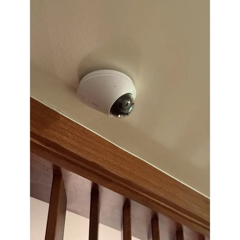 Security camera installation detail under a covered exterior structure.
