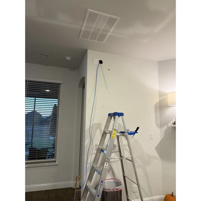 Interior work area staged for low-voltage or network installation.