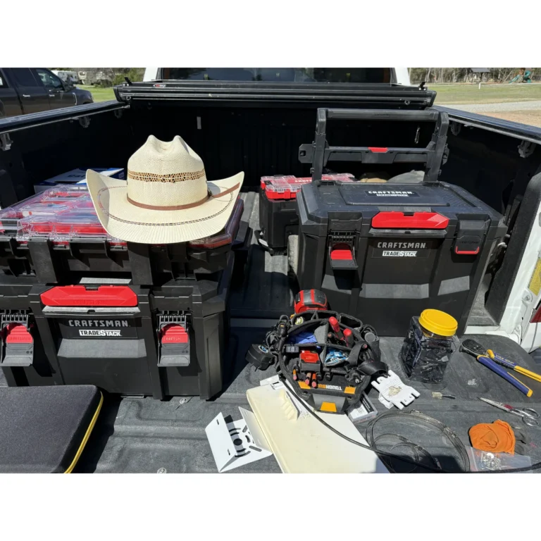 Service truck loaded with tools and cabling gear for field work.