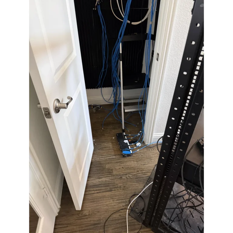 Structured cabling routed and organized along a wall during installation.