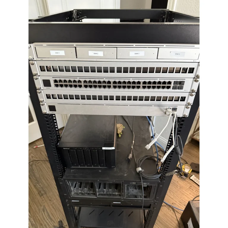 Rack-mounted network equipment stacked and connected inside a cabinet.