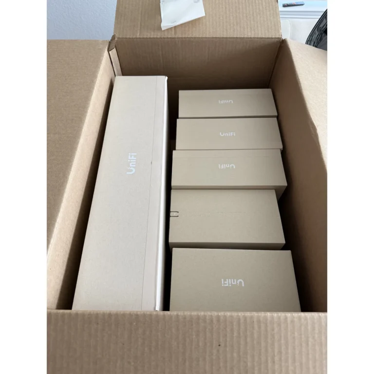 UniFi equipment boxes staged for a network or Wi-Fi installation.