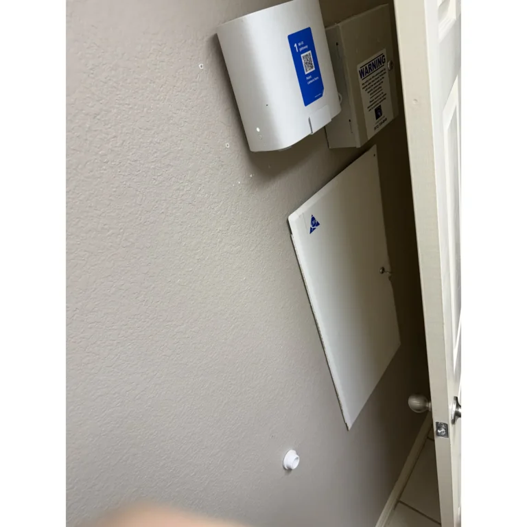 Wall-mounted low-voltage enclosure installed for structured cabling or connected equipment.