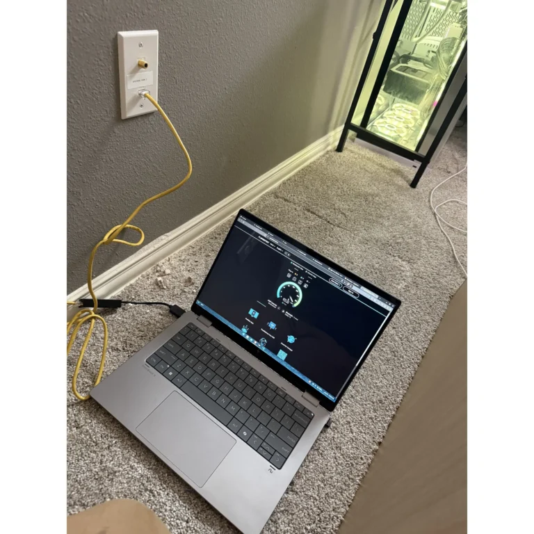 Laptop used onsite for network device configuration during a Texas 67 Systems field project.
