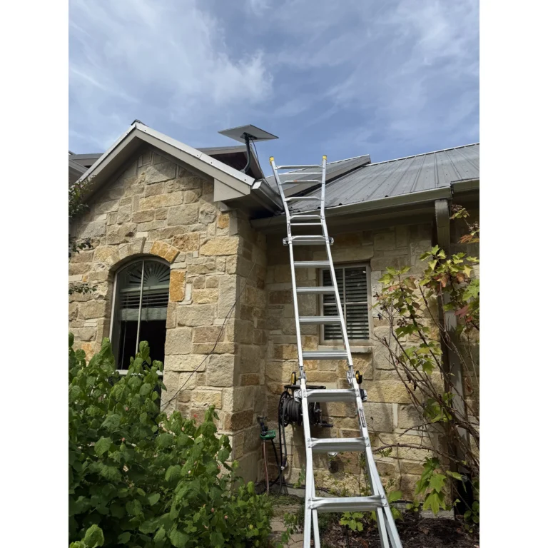 Ladder setup outside a North Texas property for exterior technology installation work.